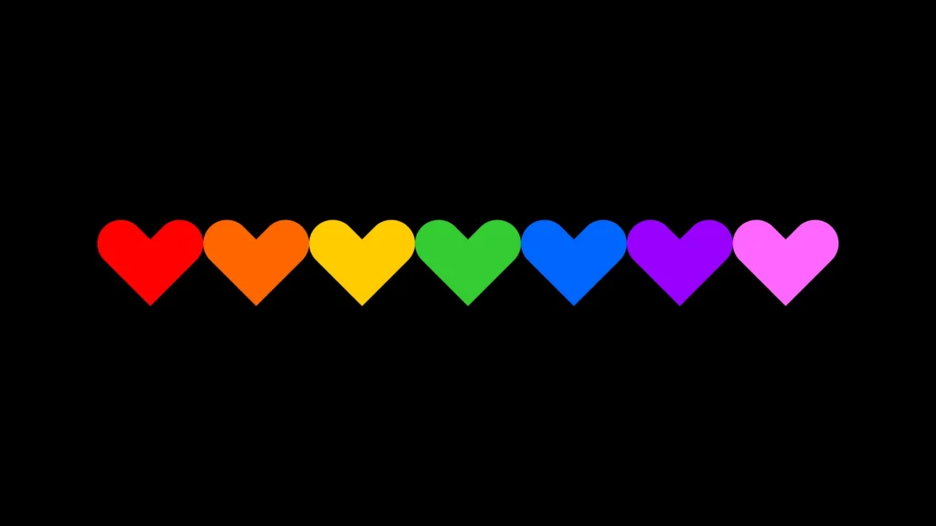 A black background, with 7 hearts comprised of red, orange, yellow, green, blue, purple and pink, representing a Commitment To Safety Diversity Equity and Inclusion